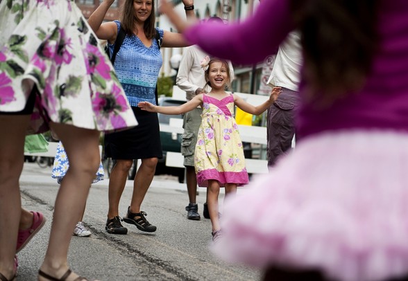 Charlotte Hildebrandt, six, learns Anglo-American dance with her family and others at the Dancing in the Streets Festival on Sunday. Daniel Brenner I AnnArbor.com